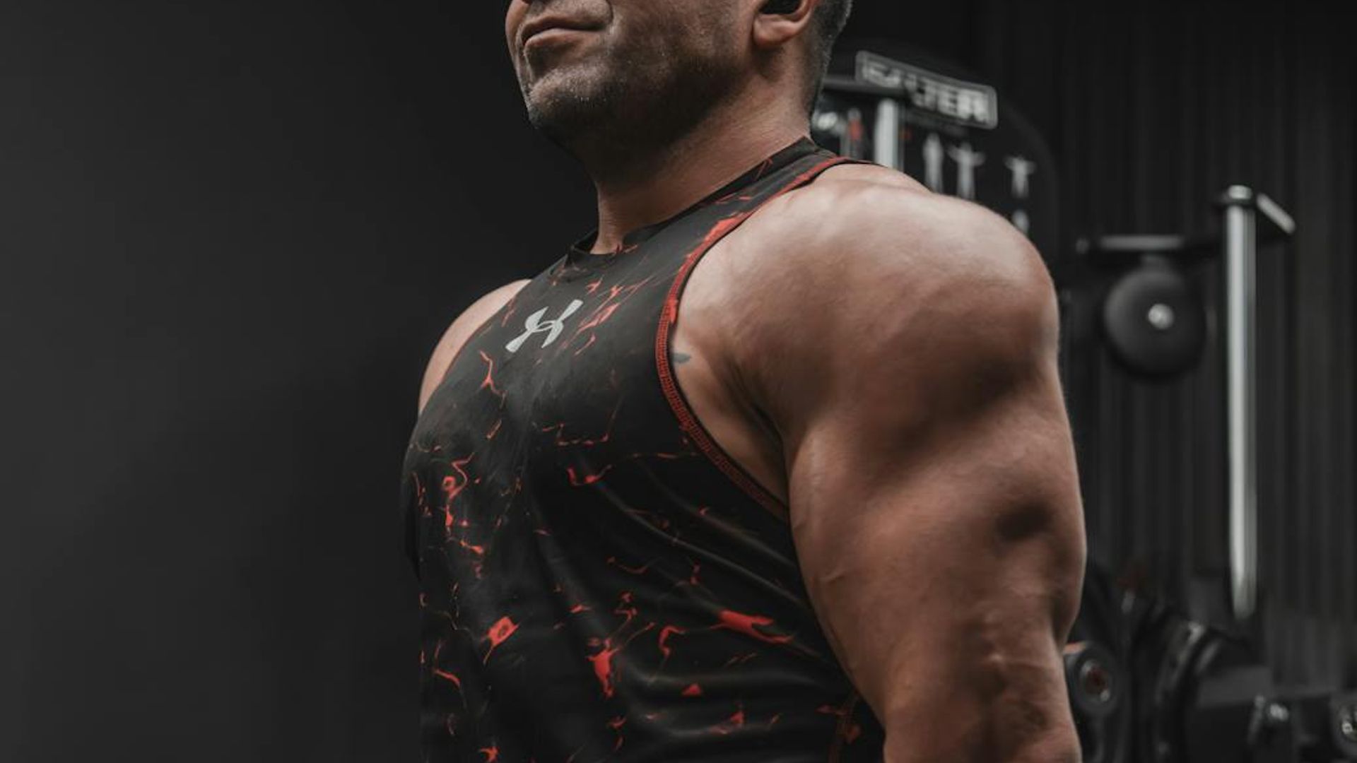 Dark, atmospheric gym setting with focused lighting.